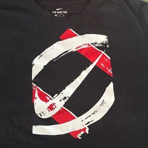 Nike Men's Black Tee with Red and White Brushstroke Design